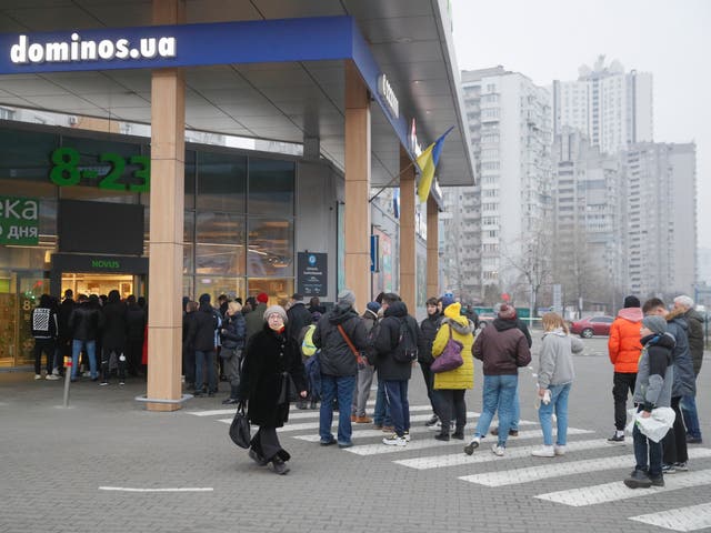<p> People waiting outside a supermarket in Kyiv, Ukraine</p>