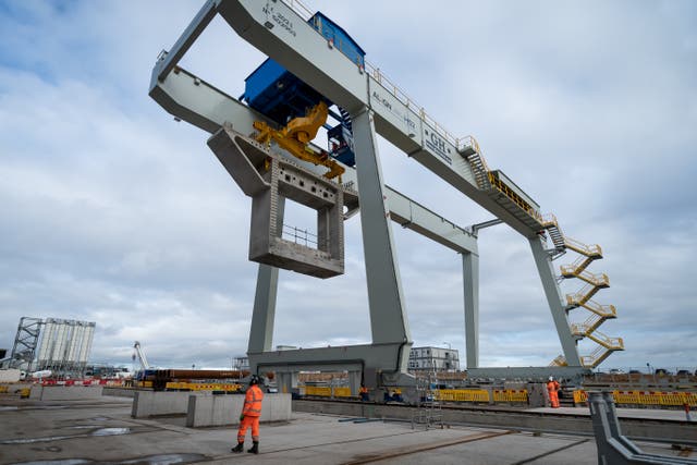 A concrete segment is carried by a crane at the HS2/Align Compound in Rickmansworth, Hertfordshire (Aaron Chown/PA)