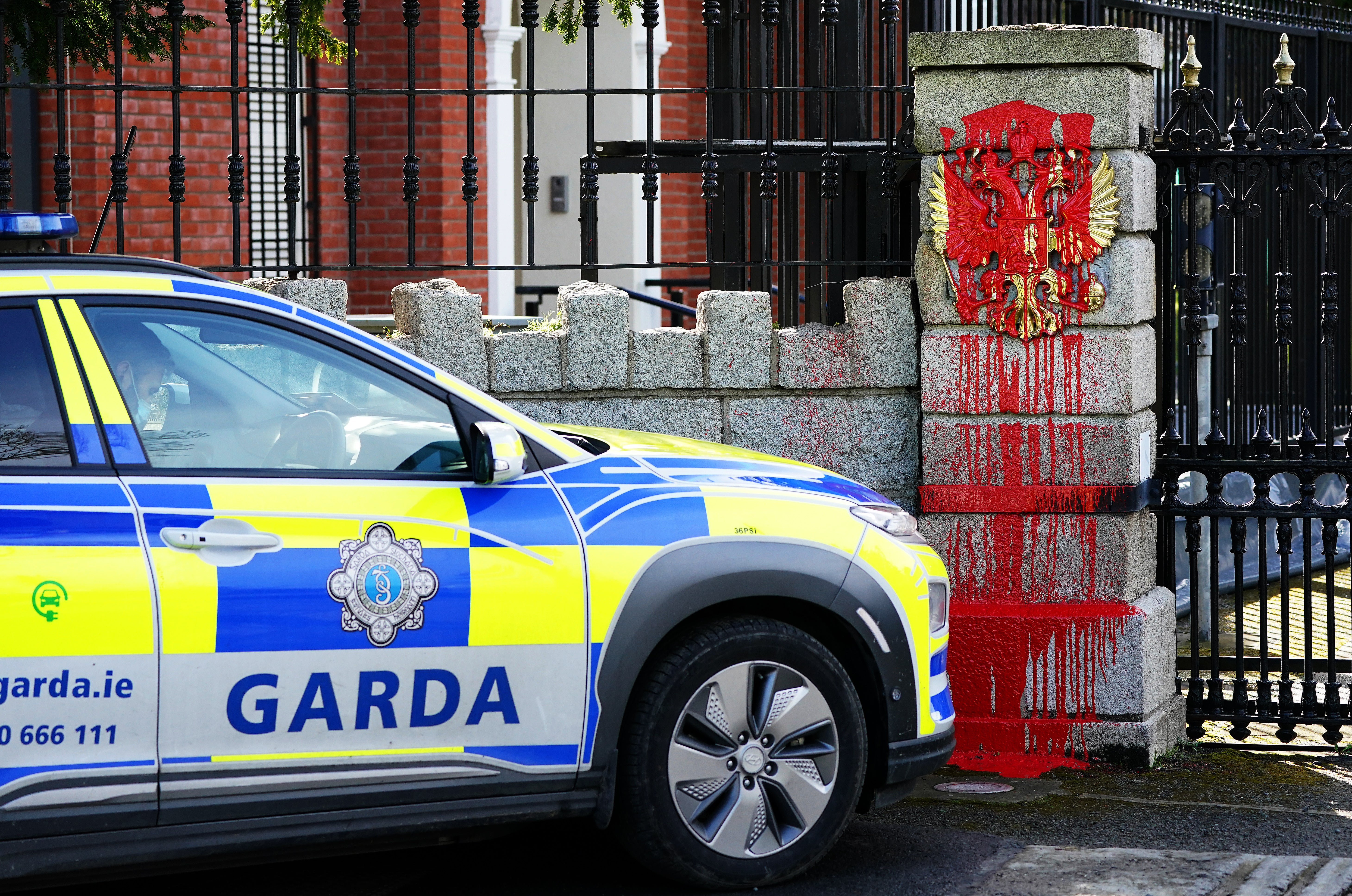 Members of An Garda at the entrance to the Embassy of Russia (Brian Lawless/PA)