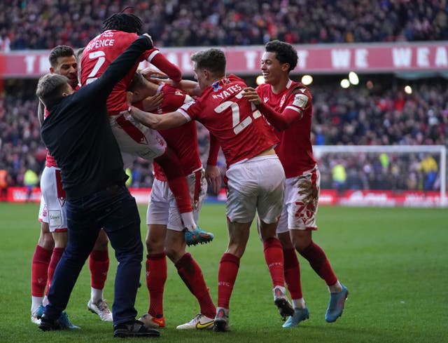 A Leicester City fan invades the pitch as Nottingham Forest players celebrate a goal (Tim Goode/PA)