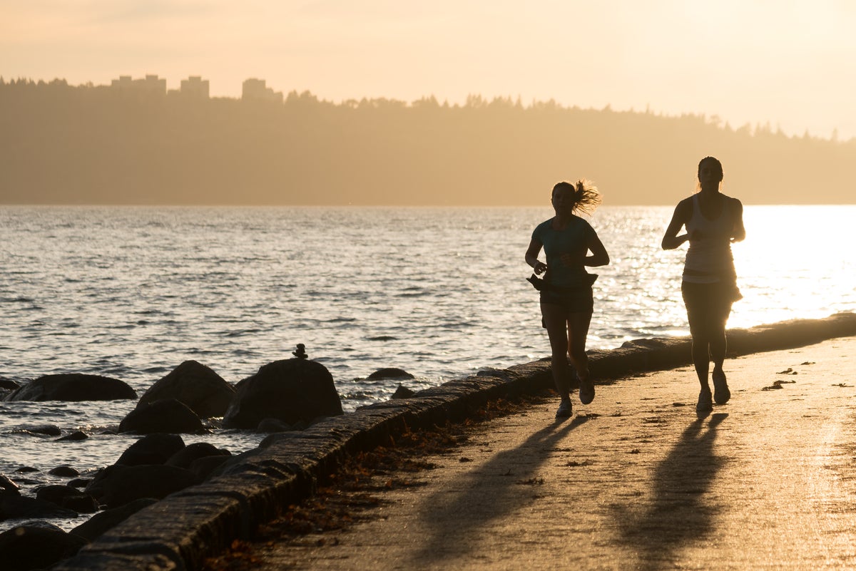 Jogging along the Stanley Park seawall at sunset