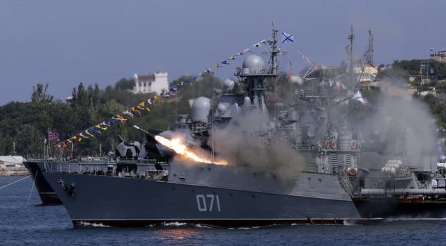 <p> A Russian navy ship fires missiles during Navy Day celebrations in the Crimean city of Sevastopol in 2015 </p>