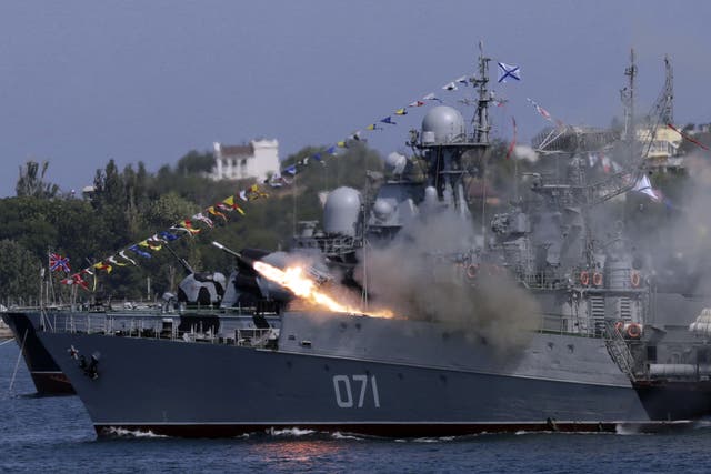 <p> A Russian navy ship fires missiles during Navy Day celebrations in the Crimean city of Sevastopol in 2015 </p>