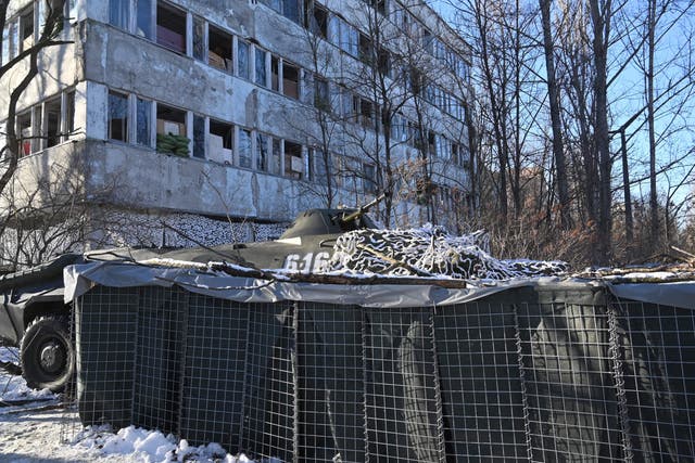 <p>This photograph taken on February 4, 2022 shows an armoured vehicle as servicemen take part in a joint tactical and special exercises of the Ukrainian Ministry of Internal Affairs, the Ukrainian National Guard and Ministry Emergency in a ghost city of Pripyat, near Chernobyl Nuclear Power Plant. </p>