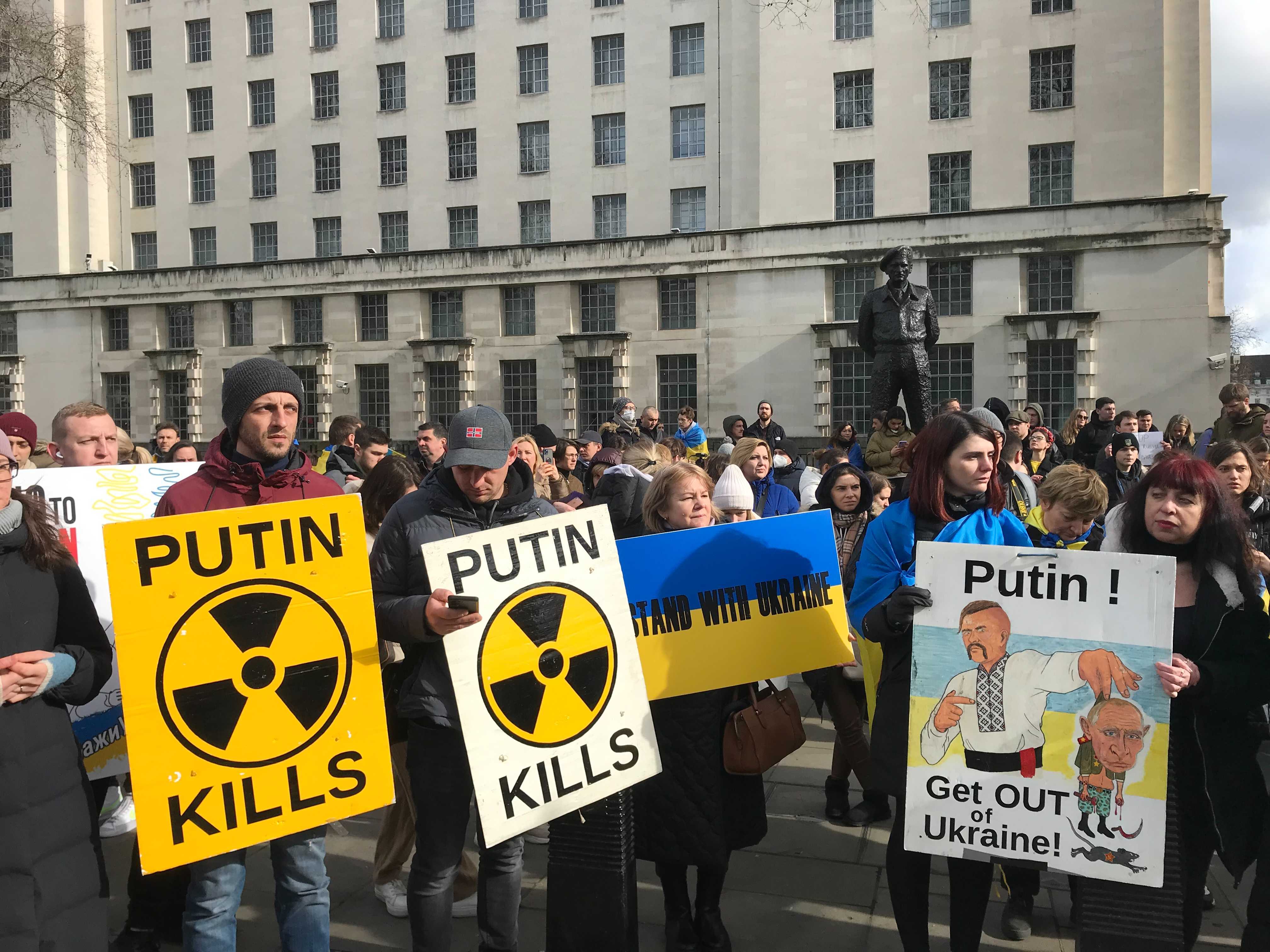 Members of the Ukrainian diaspora demonstrate against the Russian invasion outside Downing Street today