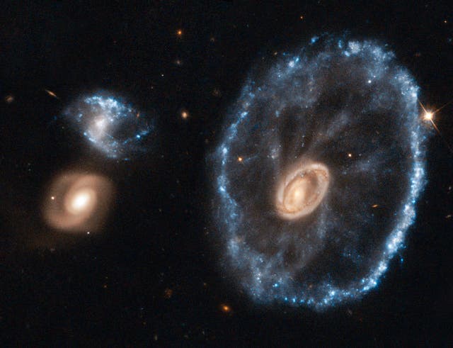 <p>An image of the Cartwheel galaxy taken by the Hubble telescope</p>