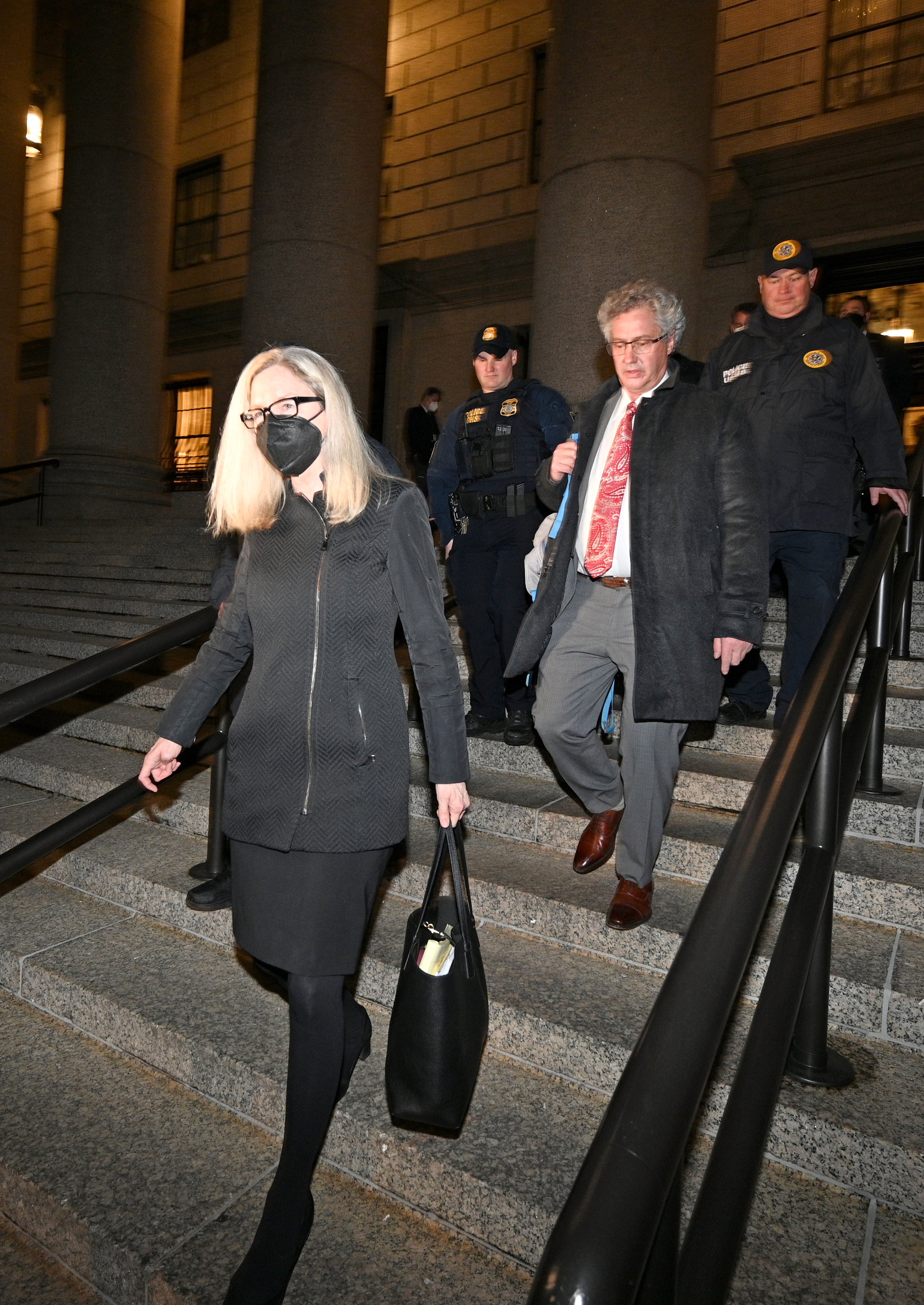 Defence attorneys Laura Menninger (left) and Jeffrey Pagliuca (middle right) leaving the federal courthouse in the Southern District of New York (Anthony Behar/PA)