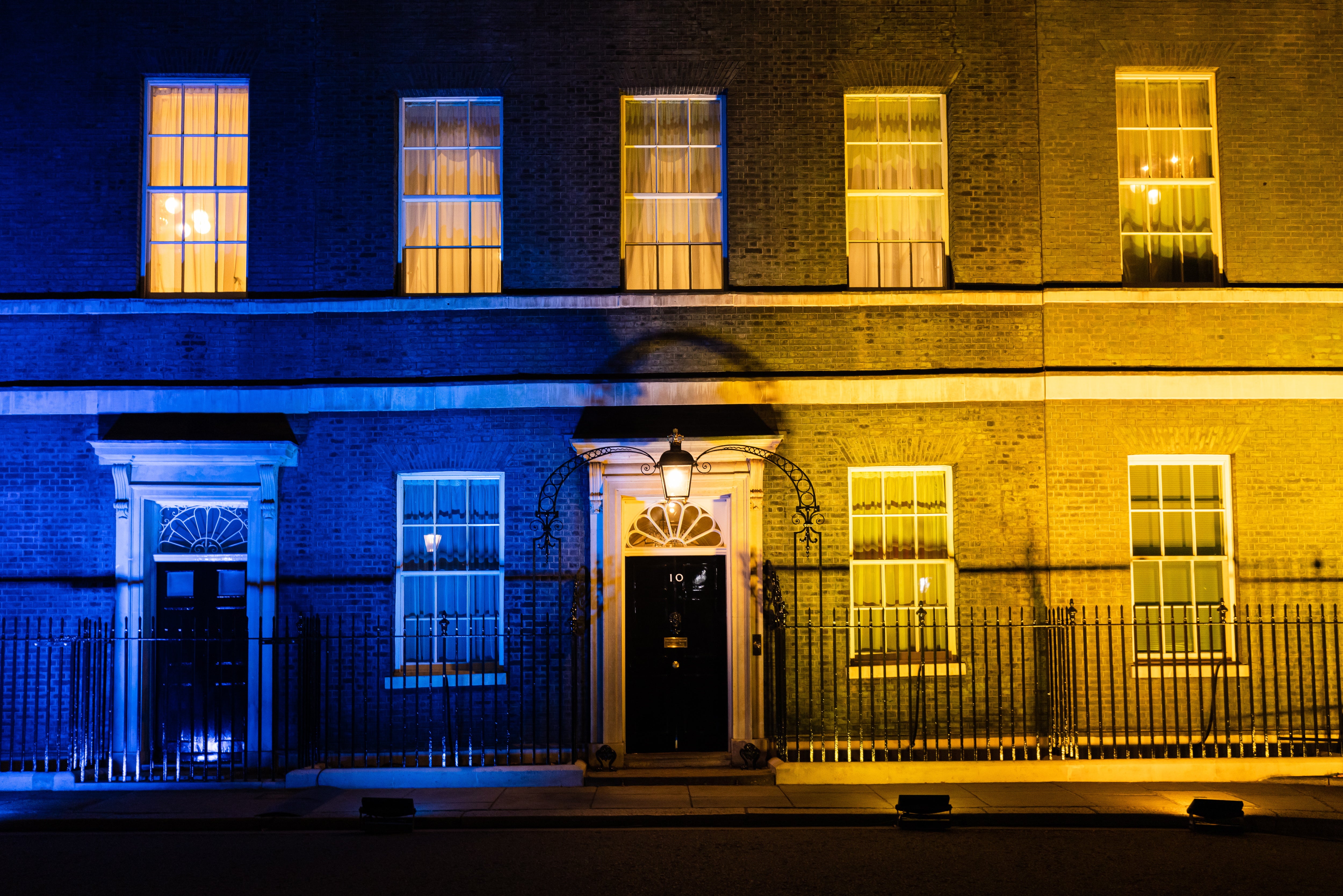 <p>10 Downing Street lit up in blue and yellow in solidarity with Ukraine</p>
