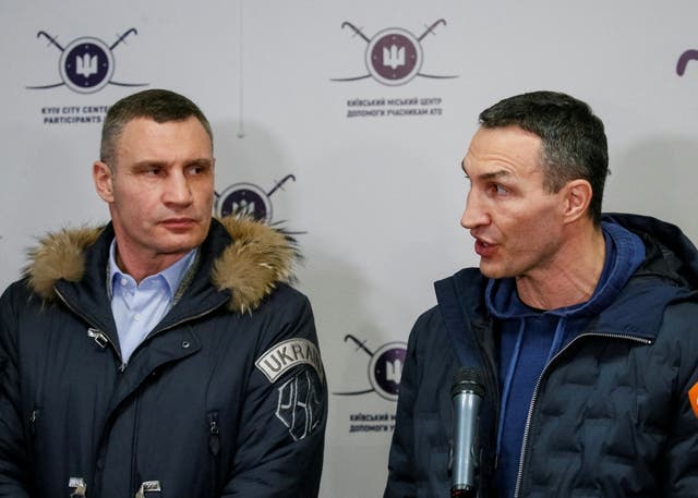 <p>Vitali, left, and Wladimir Klitschko address the media in Kyiv</p>