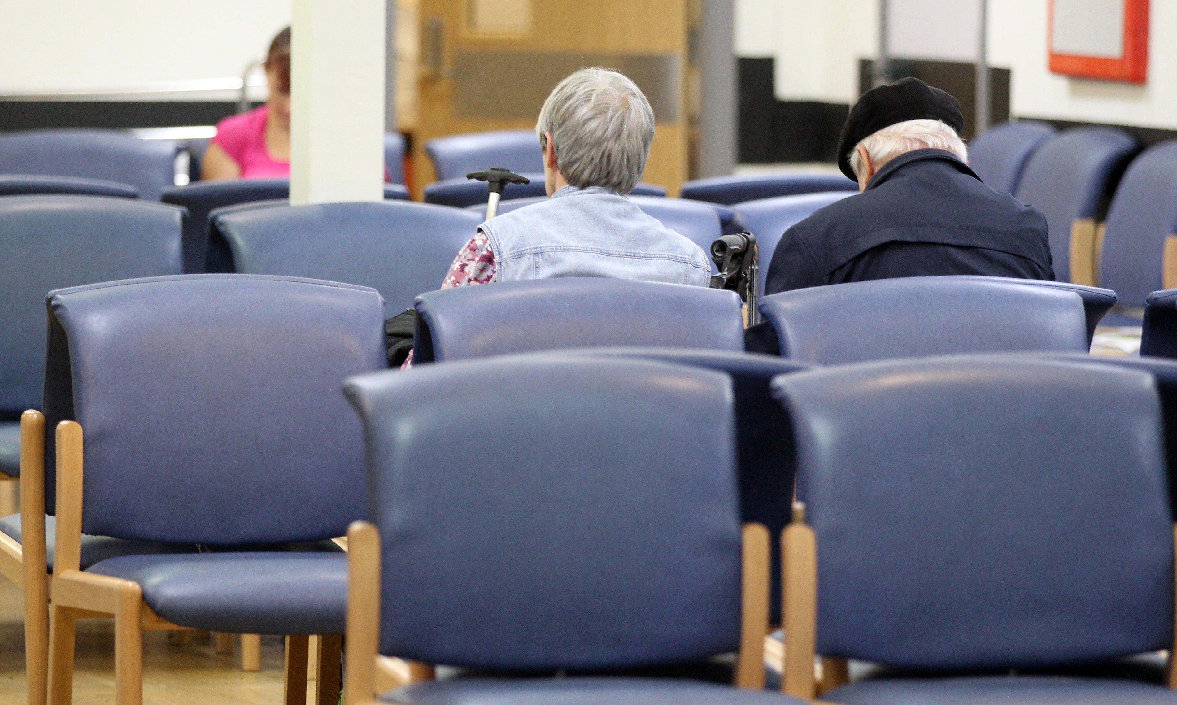 Patients in a hospital waiting room (Lynne Cameron/PA)