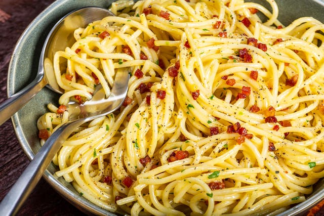 <p>Spaghetti carbonara consists of pasta coated in an egg-and-cheese-based sauce that's enlivened with lots of black pepper and bits of cured meat</p>