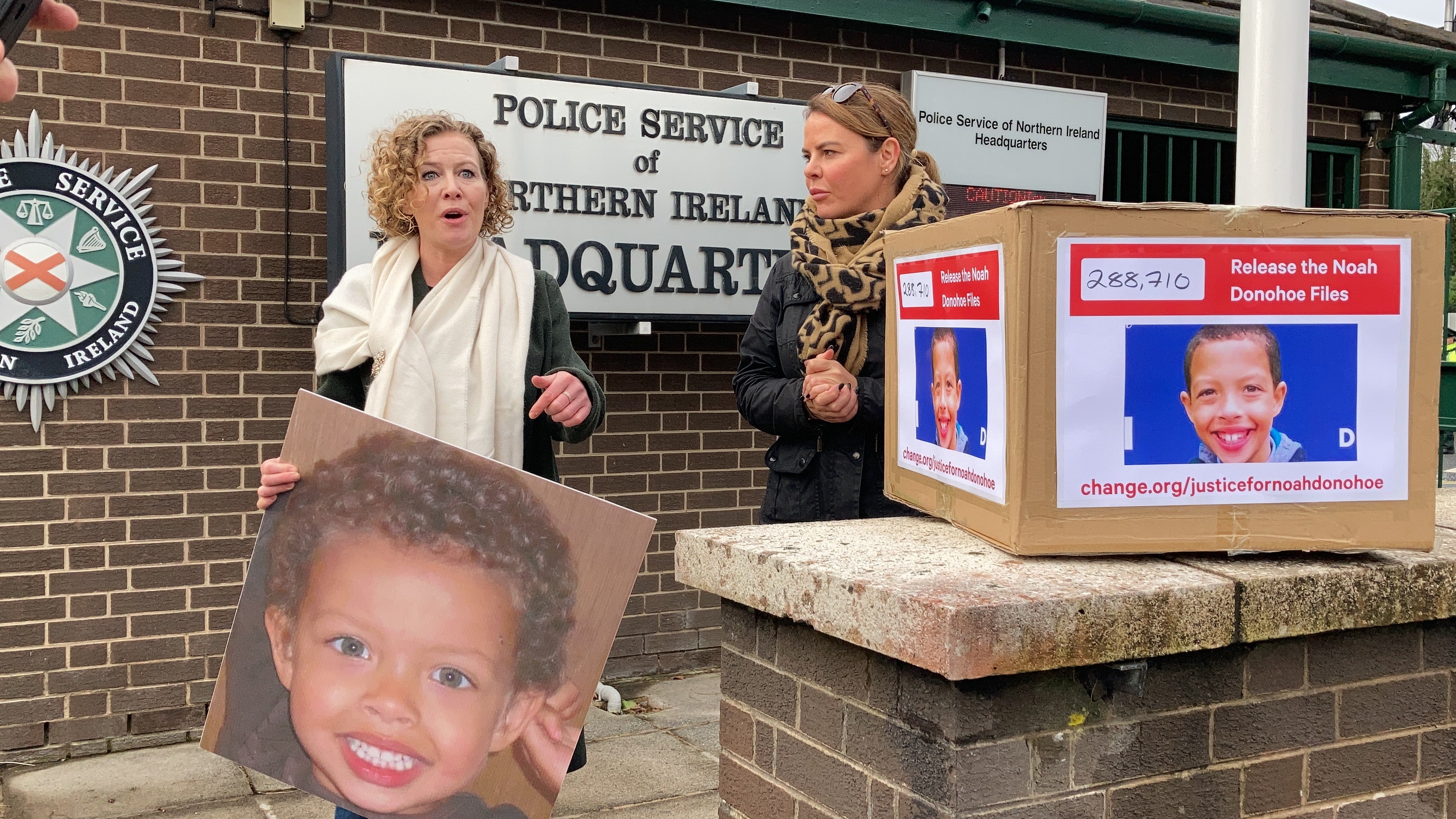 Fiona Donohoe and her sister Niamh protest at PSNI headquarters in Belfast in pursuit of justice following the death of her 14-year-old son Noah (Rebecca Black/PA)