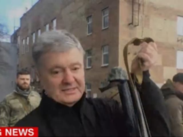 <p>Mr Poroshenko showed off a Kalashnikov </p>