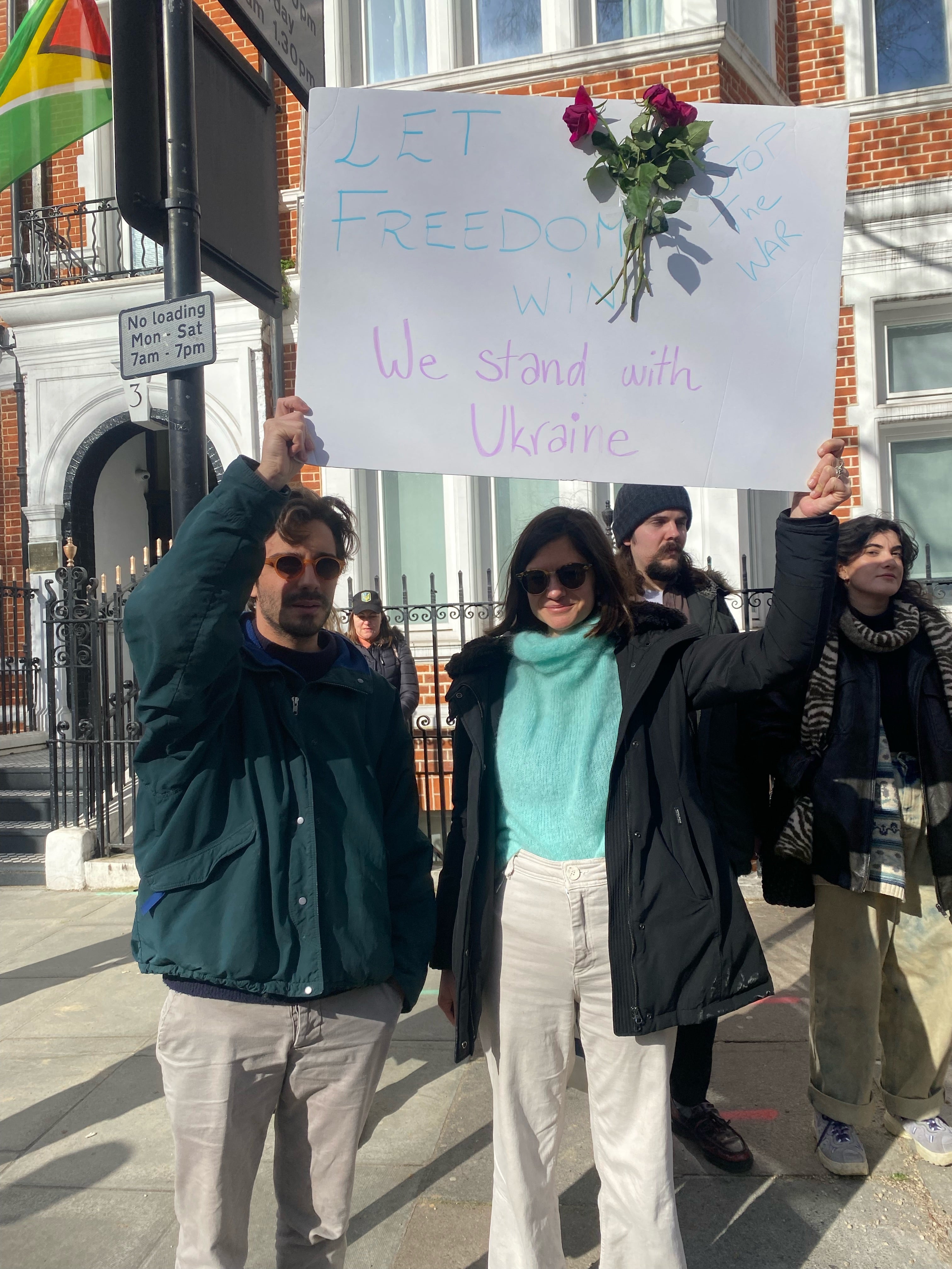 Two Italians hold up a placard to show their solidarity with Ukraine in London on 25 February, 2022