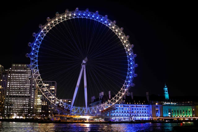 <p>The London Eye is lit up in the colours of the Ukrainian flag in solidarity with Kyiv on 25 February, 2022</p>