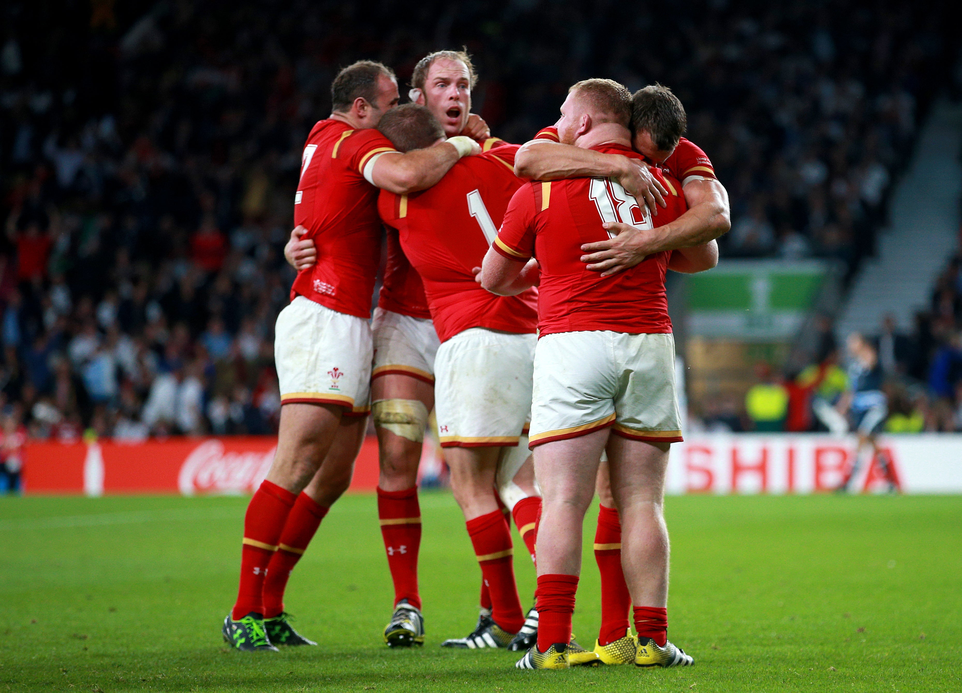 Wales players celebrate victory over England at Twickenham (David Davies/PA)