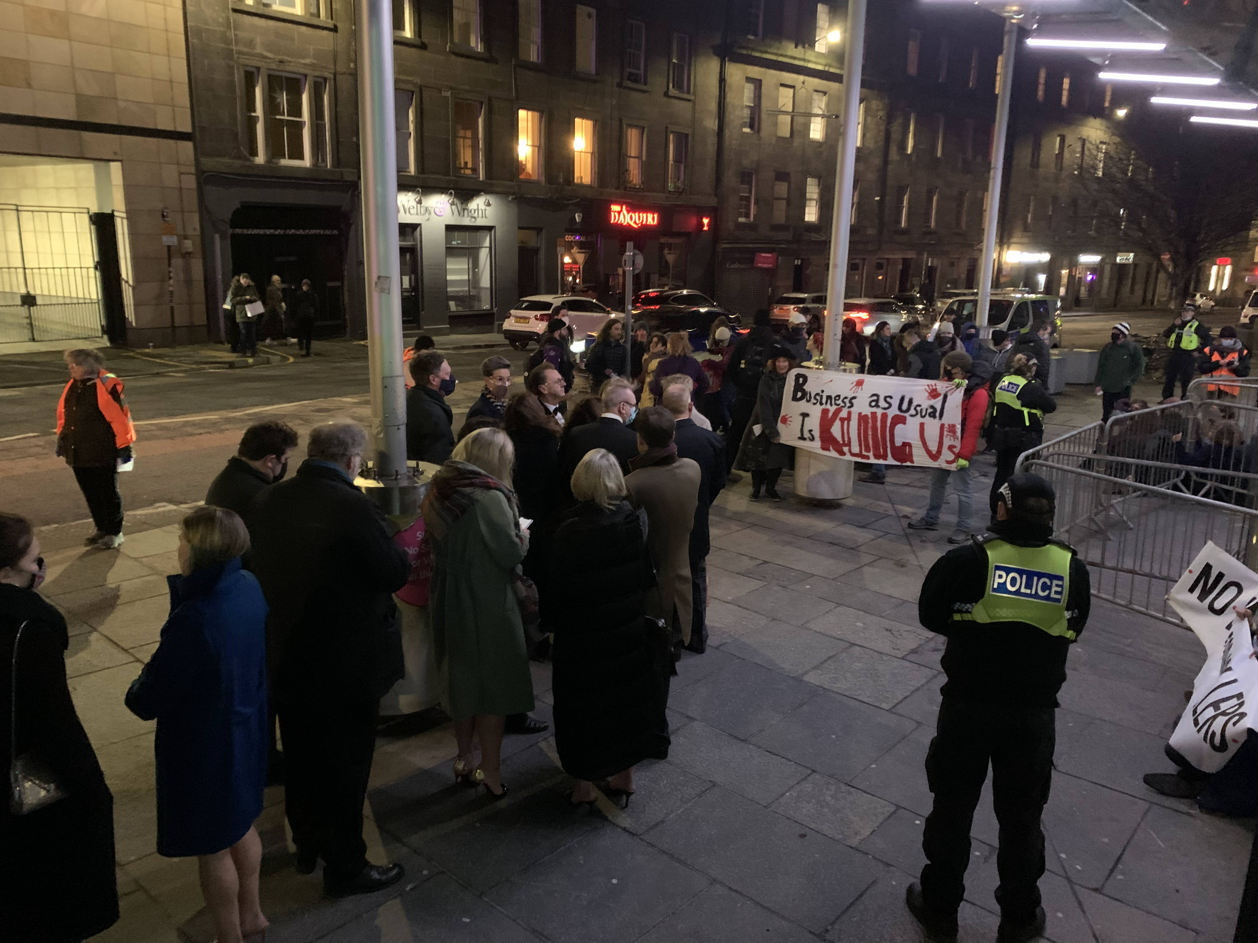 Activists protesting outside the Edinburgh International Conference Centre where the annual Scottish Energy Forum’s dinner is being held (Extinction Rebellion Scotland/PA)