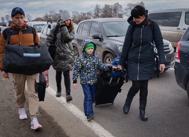 <p>A family among the thousands heading to Poland</p>