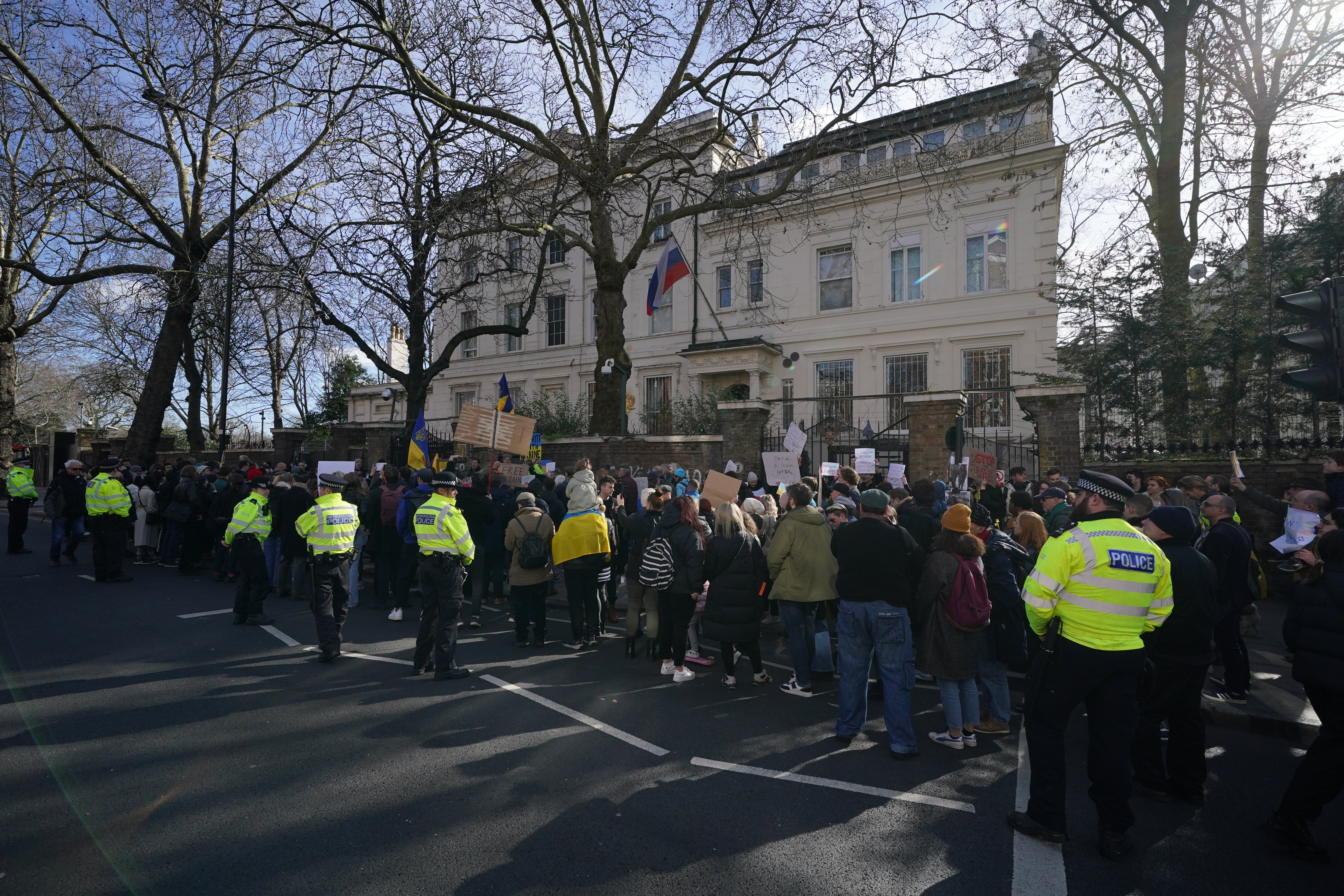 People take part in a demonstration outside the Russian Embassy in Kensington Palace (Jonathan Brady/PA)