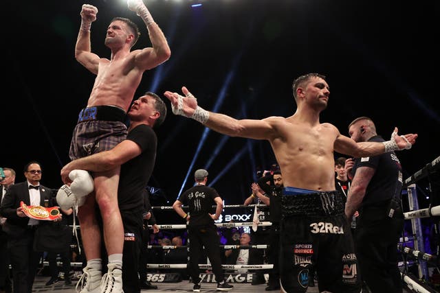 <p>Jack Catterall (right) reacts to his points defeat by Josh Taylor </p>