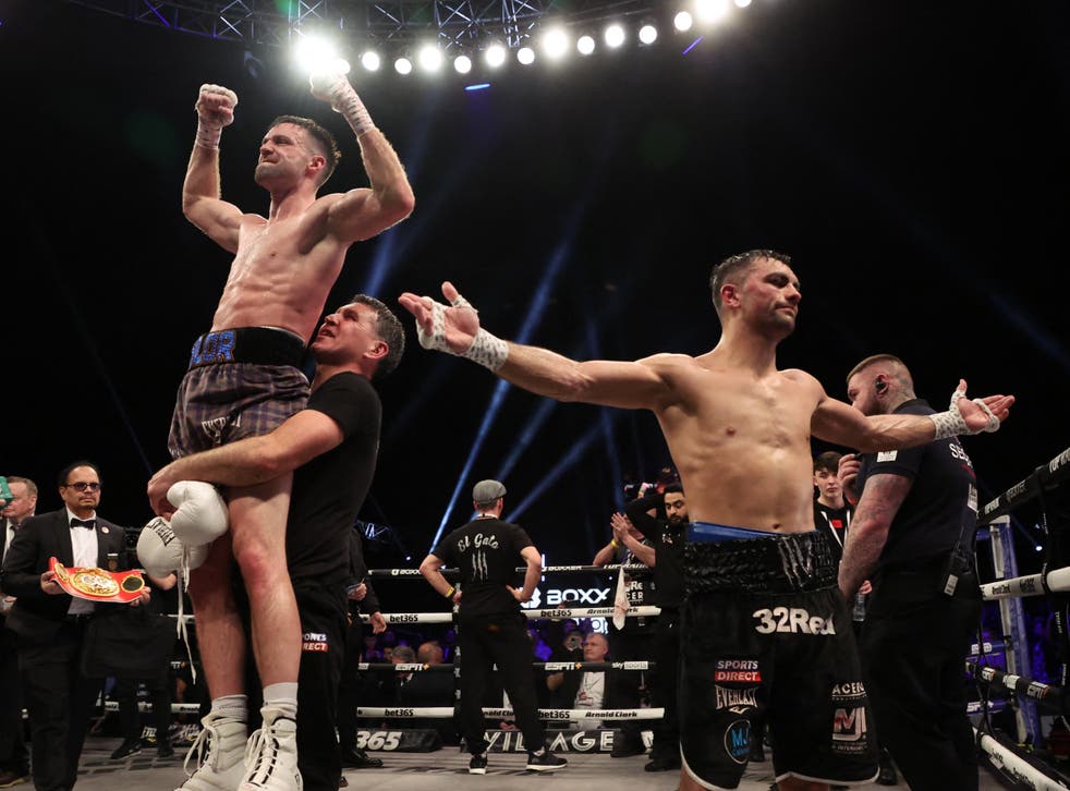 <p>Jack Catterall (right) reacts to his points defeat by Josh Taylor </p>