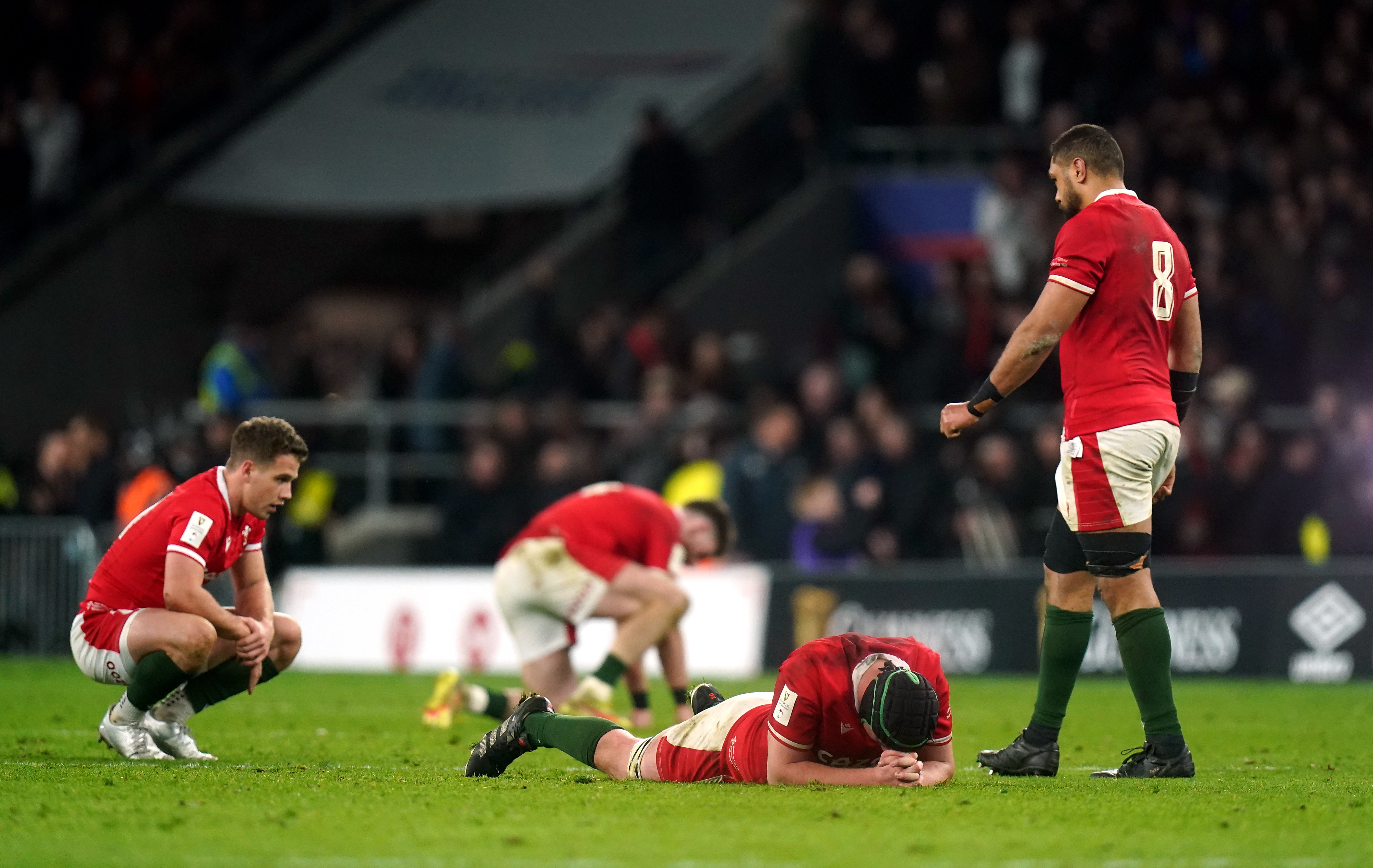 Dejected Wales players after the final whistle at Twickenham (PA)