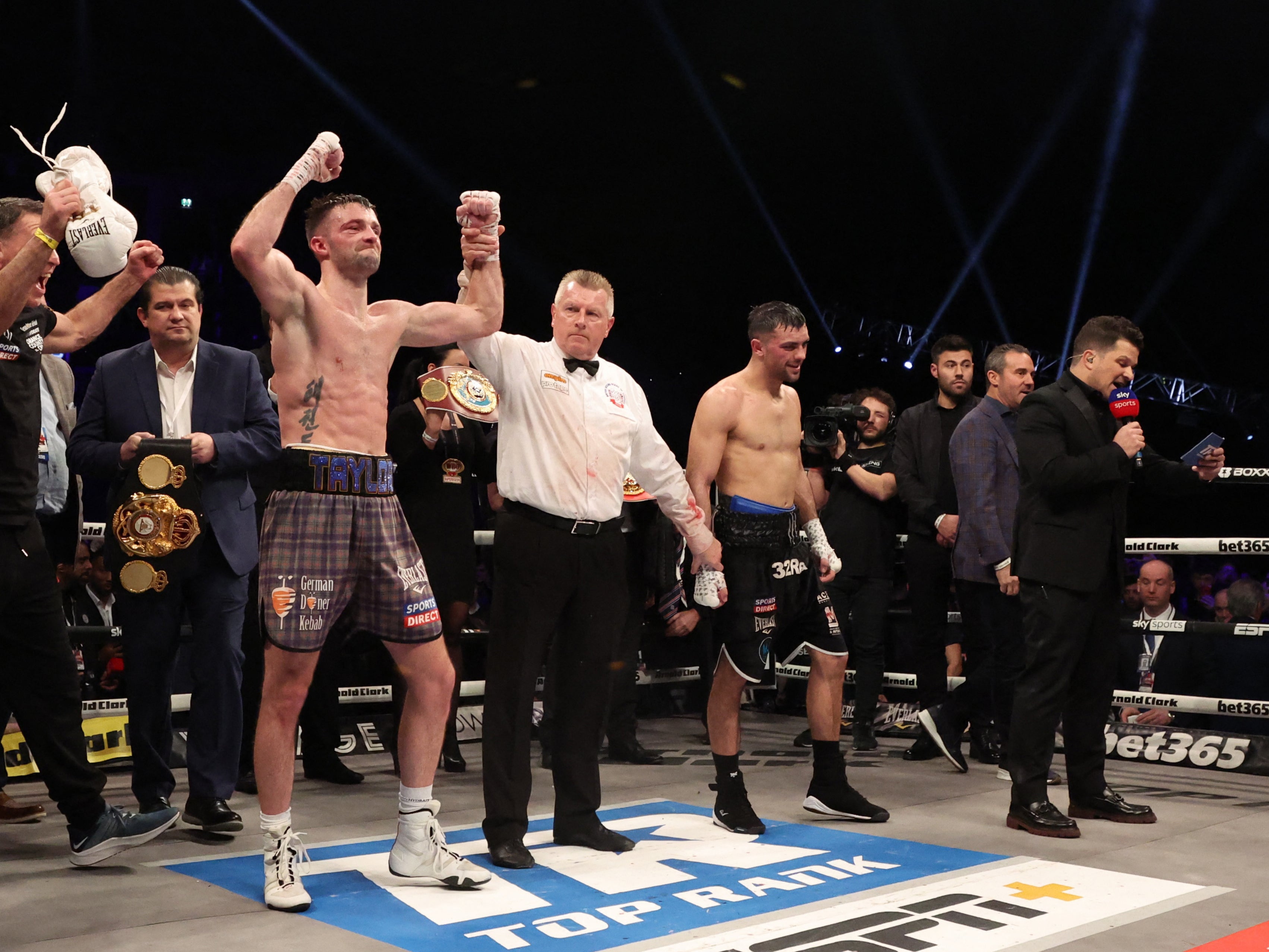 Josh Taylor (left) and Jack Catterall react to the decision after their undisputed world title fight in Glasgow