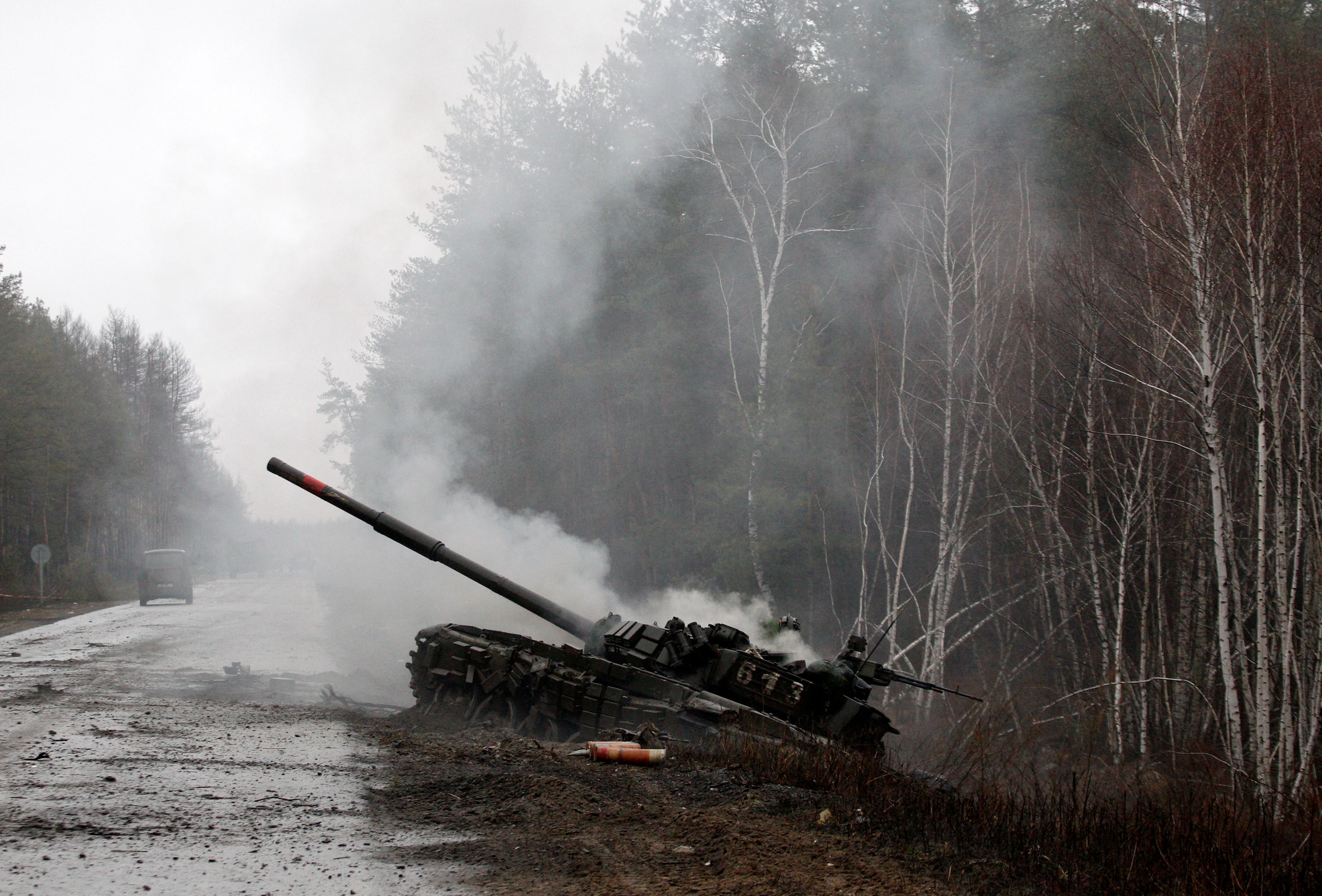 Smoke rises from a Russian tank destroyed by the Ukrainian forces in the Luhansk region