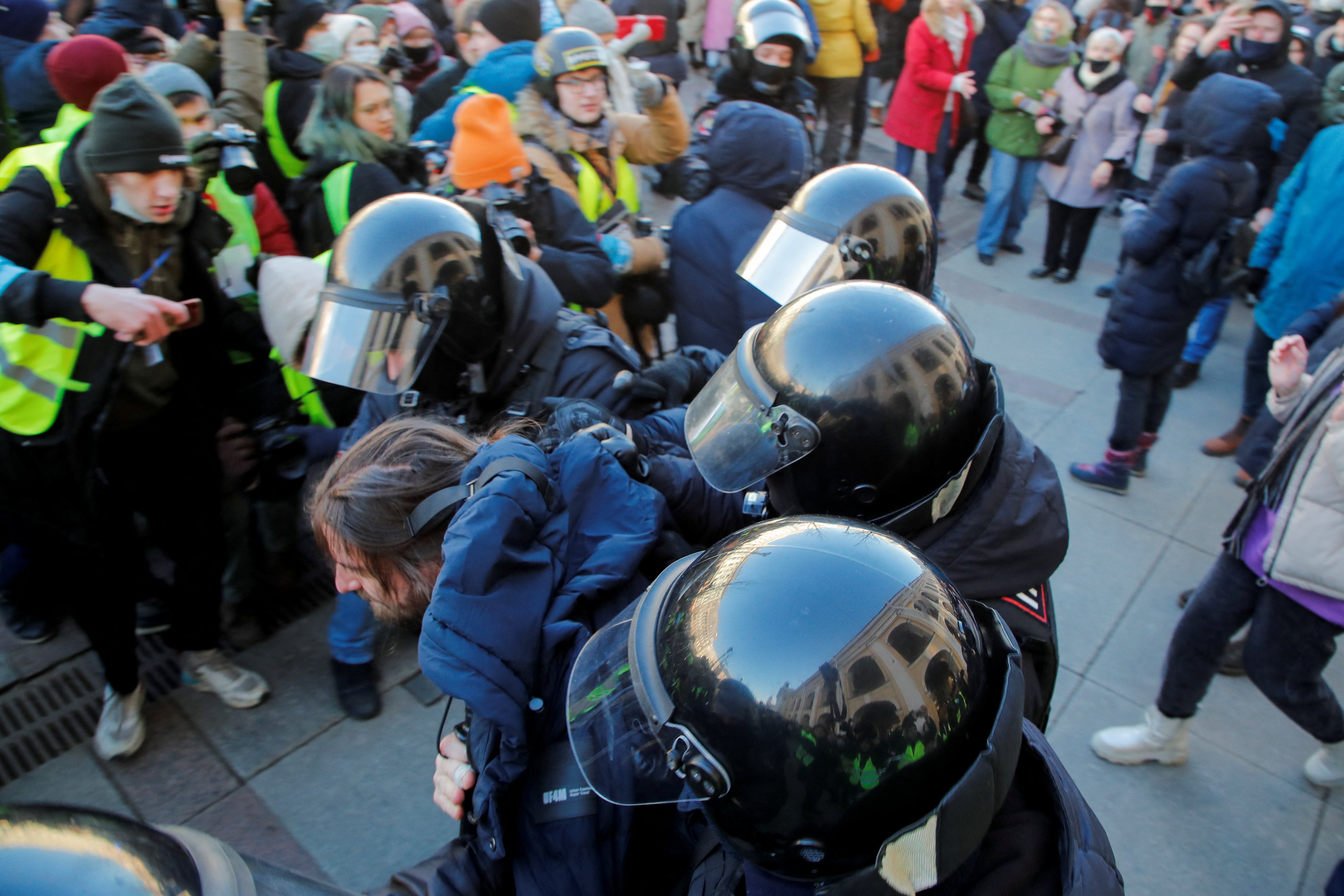 A demonstrator is detained by police officers during a protest against the Russian invasion of Ukraine, after President Vladimir Putin authorised a massive military operation, in Saint Petersburg, Russia February 27, 2022.