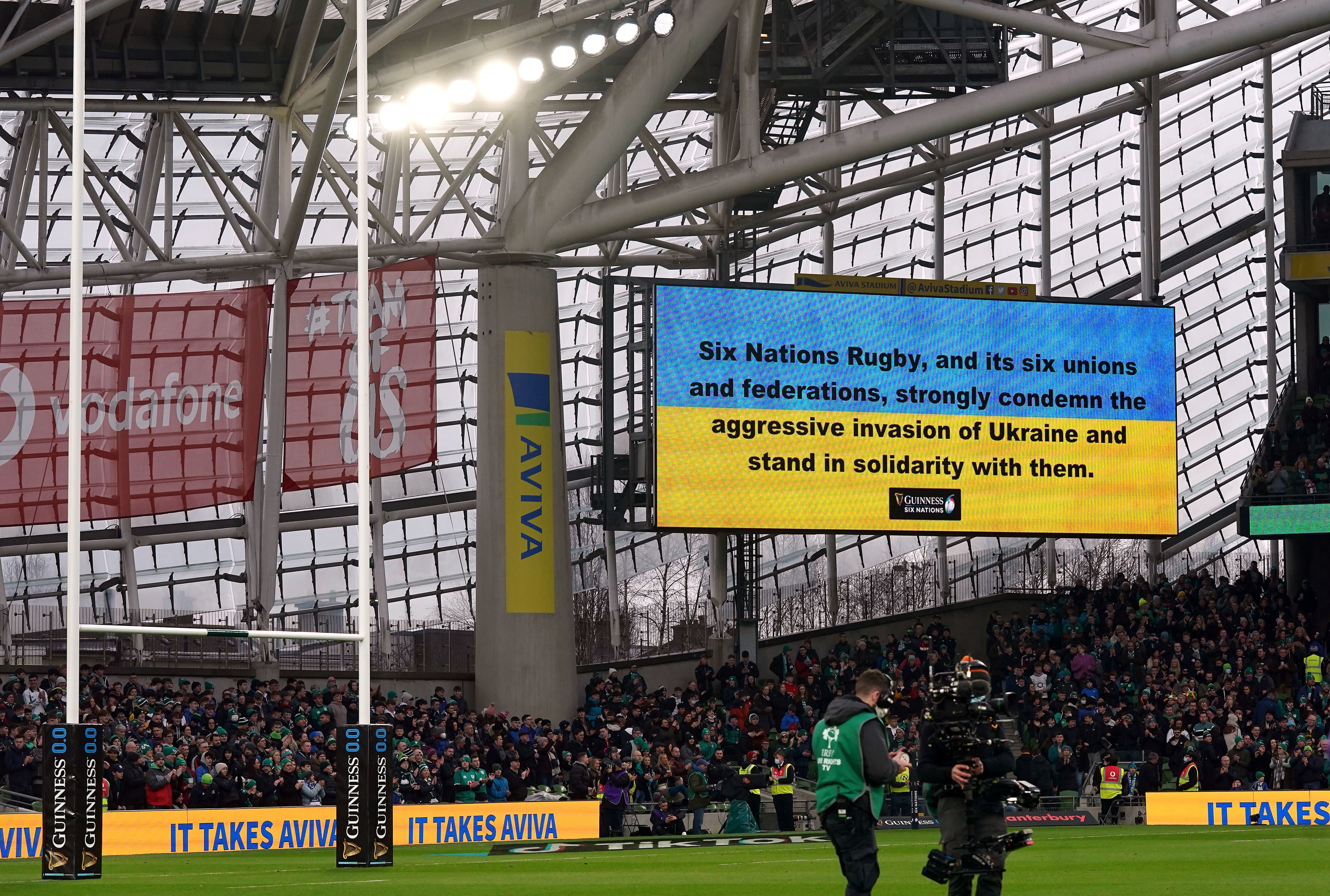 A message in support of Ukraine is shown inside the stadium before the match