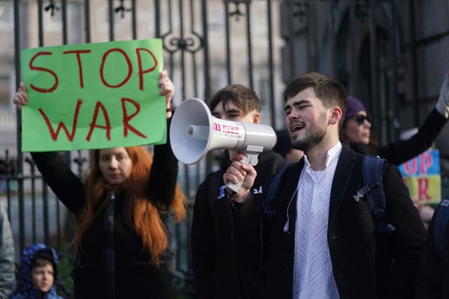 People attend a demonstration outside Leinster House in Dublin (Brian Lawless/PA)