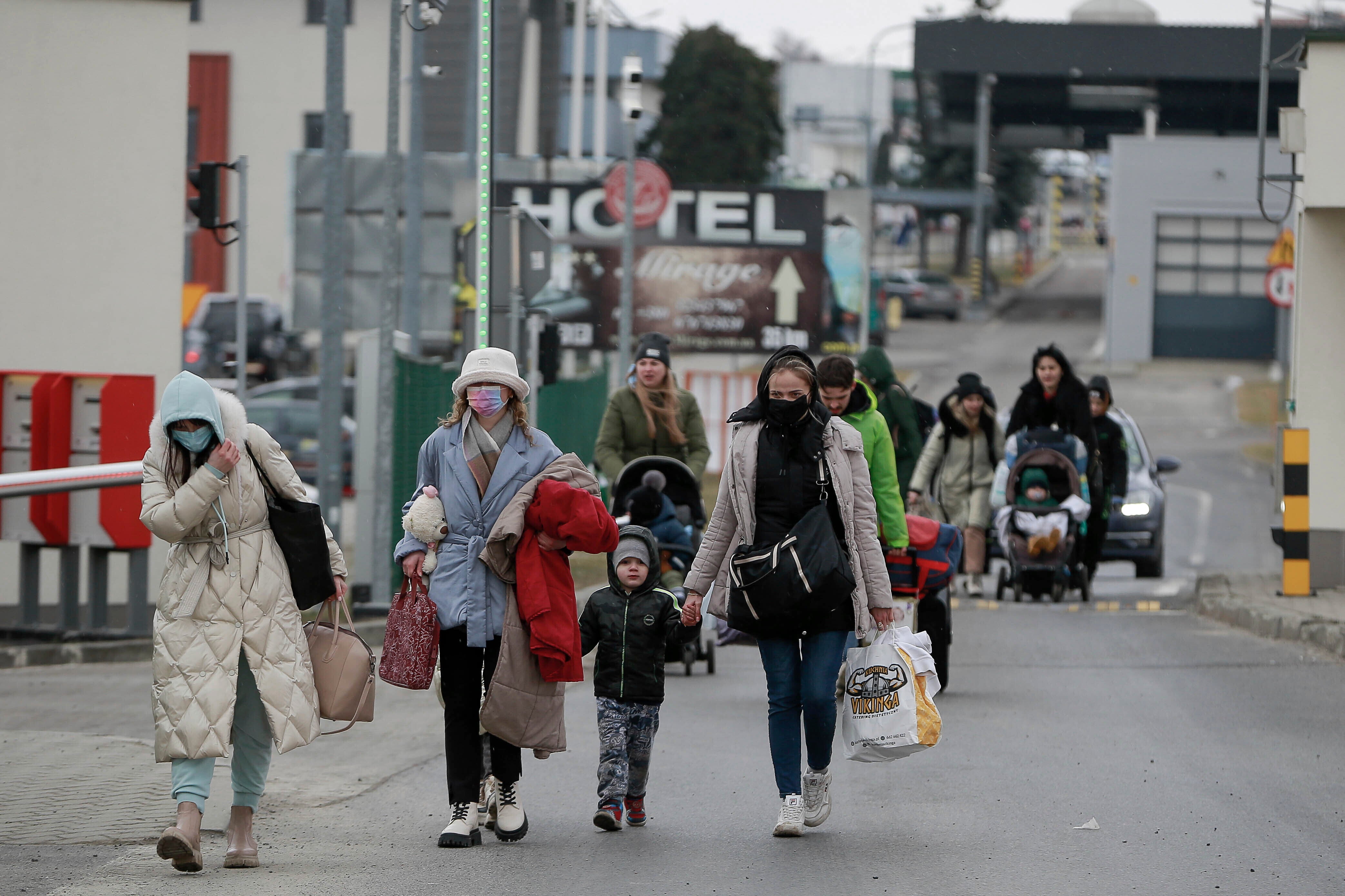 Refugees fleeing conflict in Ukraine arrive at the Medyka border crossing, in Poland, Feb. 27, 2022