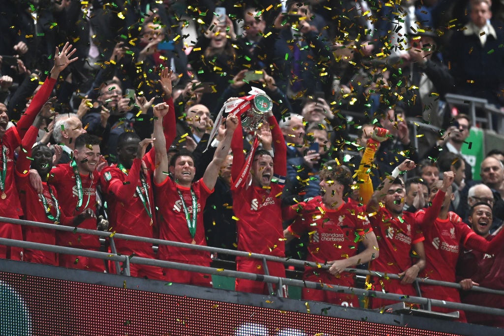 Liverpool captain Jordan Henderson lifts the Carabao Cup after a thrilling final