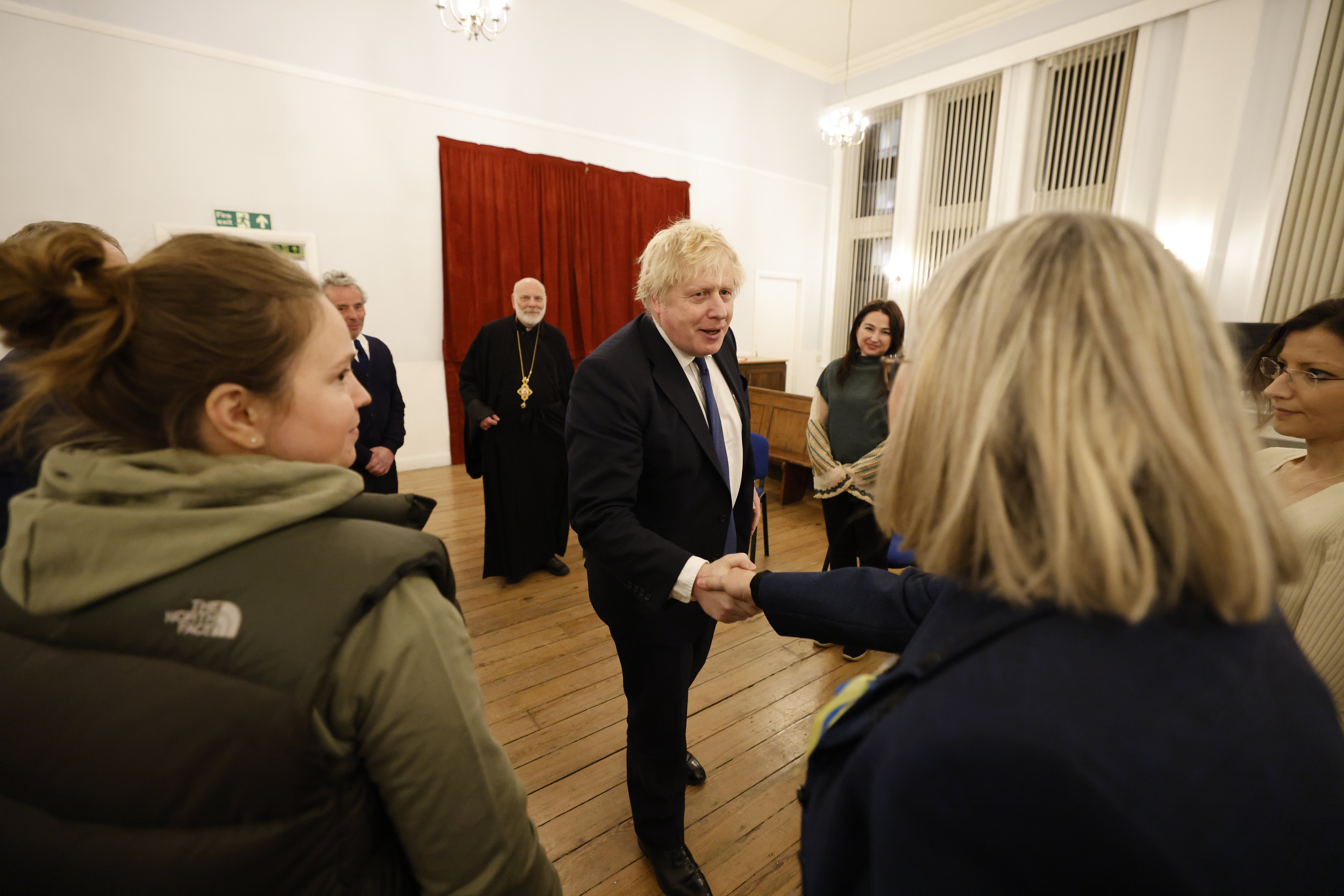British Prime Minister Boris Johnson meets members of the Ukrainian community at the Ukrainian Catholic Eparchy of Holy Family of London (Jamie Lorriman/PA)