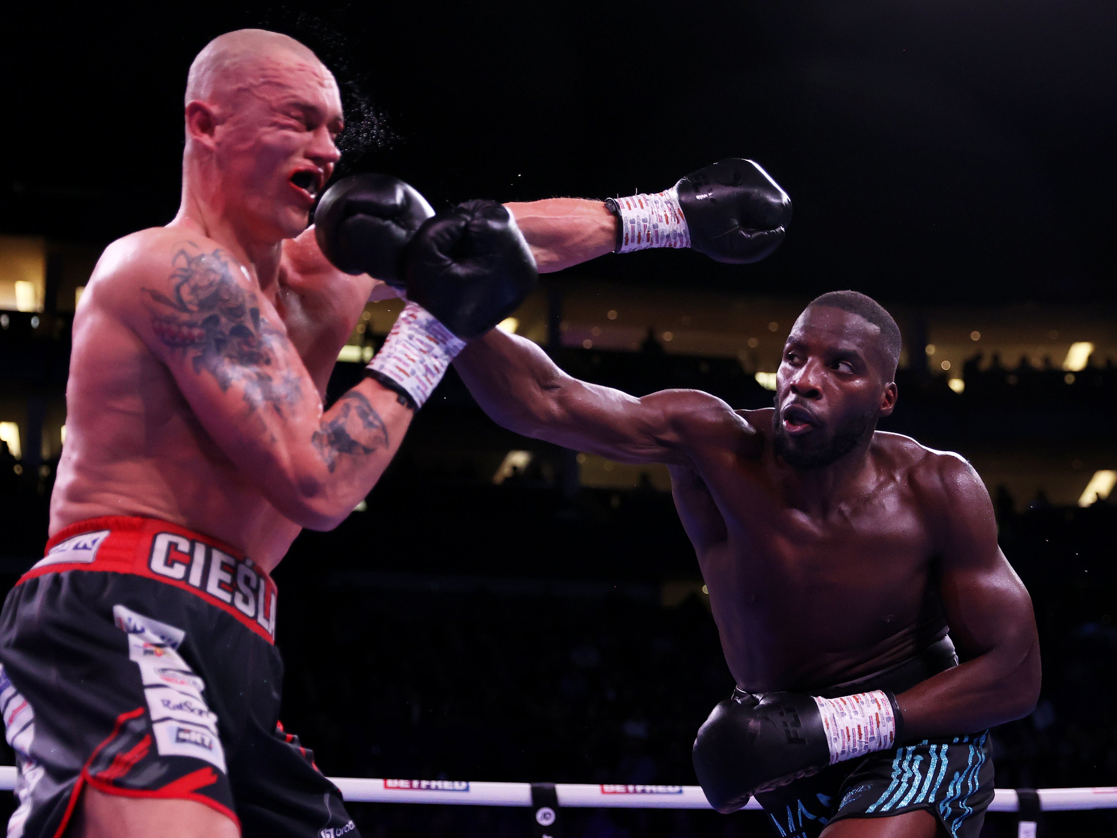 Londoner Lawrence Okolie (right) achieved a unanimous-decision win against Michal Cieslak at the O2