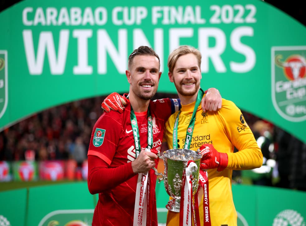 Liverpool’s Jordan Henderson and goalkeeper Caoimhin Kelleher celebrate with the Carabao Cup trophy (Nick Potts/PA)