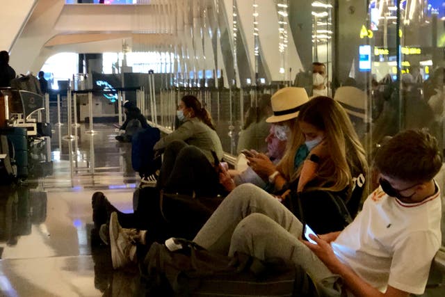 <p>Waiting game: British Airways passengers waiting for a delayed flight</p>