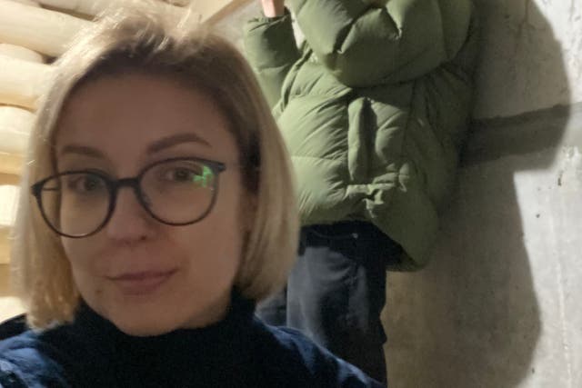 Inna Sovsun has been hiding at a friend’s house in Kyiv, where she is pictured in the basement here with her brother (Inna Sovsun)