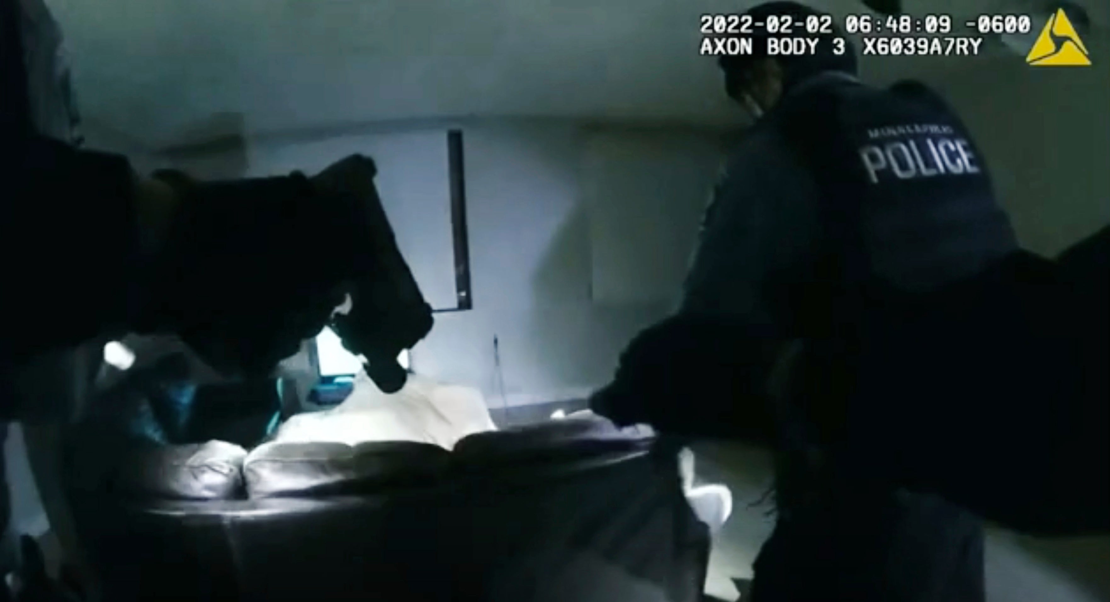 This image taken from Minneapolis Police Department body camera video shows officers entering the apartment of 22-year-old Amir Locke on 2 February 2022