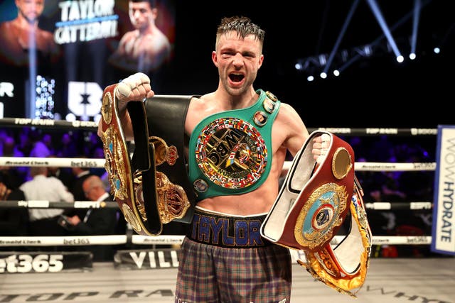 <p>Still champ: Taylor celebrates after his  contentious victory over Jack Catterall in Glasgow </p>