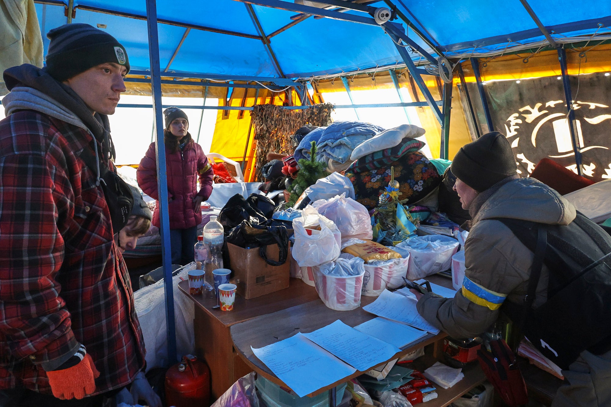 Ukrainians collect humanitarian aid in the city of Kharkiv, Ukraine, 27 February 2022.