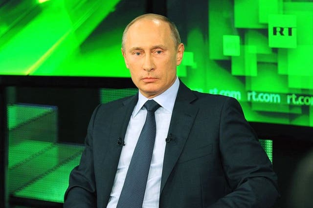 <p>Vladimir Putin on RT, formerly known as Russia Today </p>