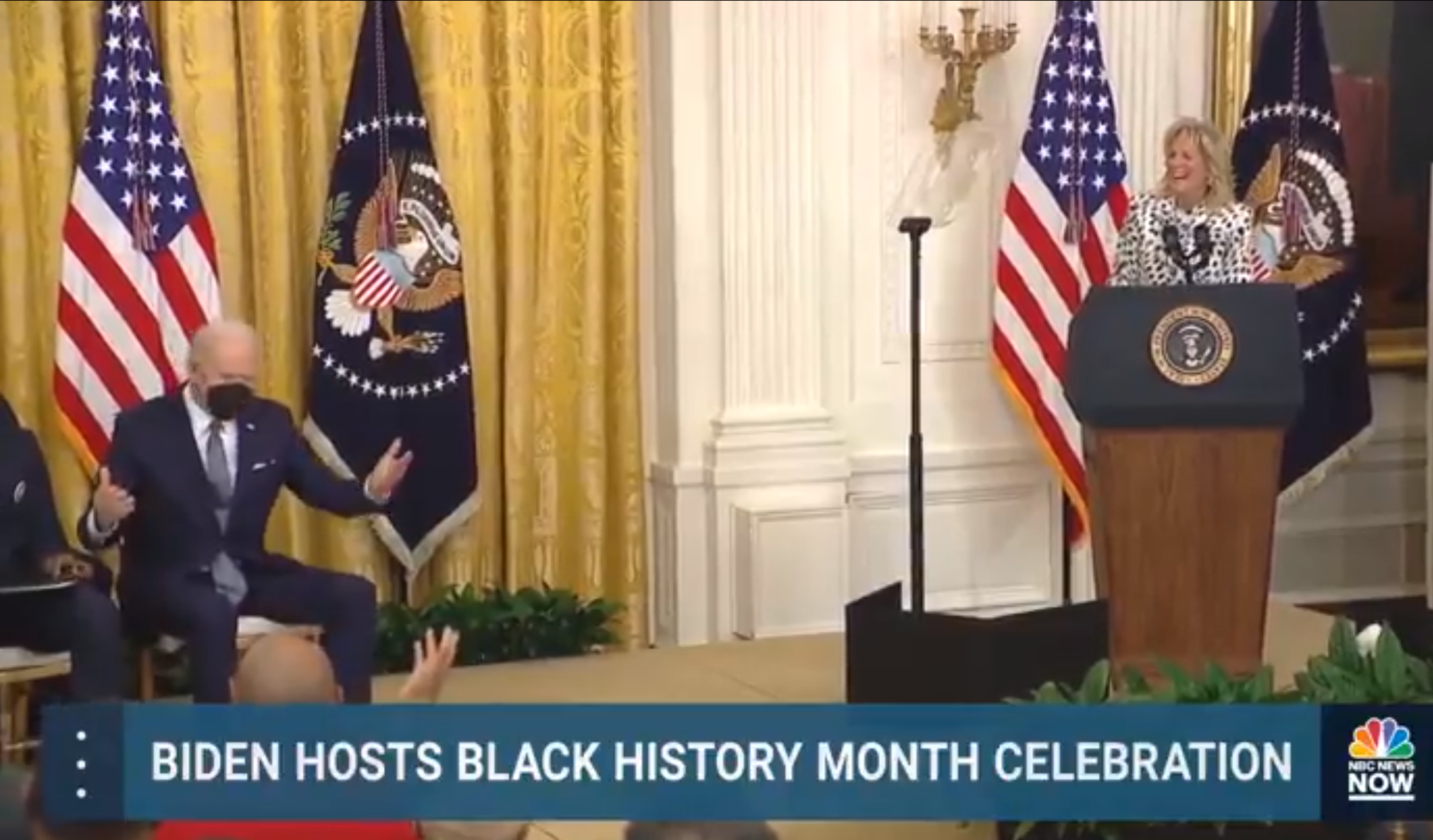 Joe Biden throws his arms in the air after the First Lady promotes Kamala Harris to president