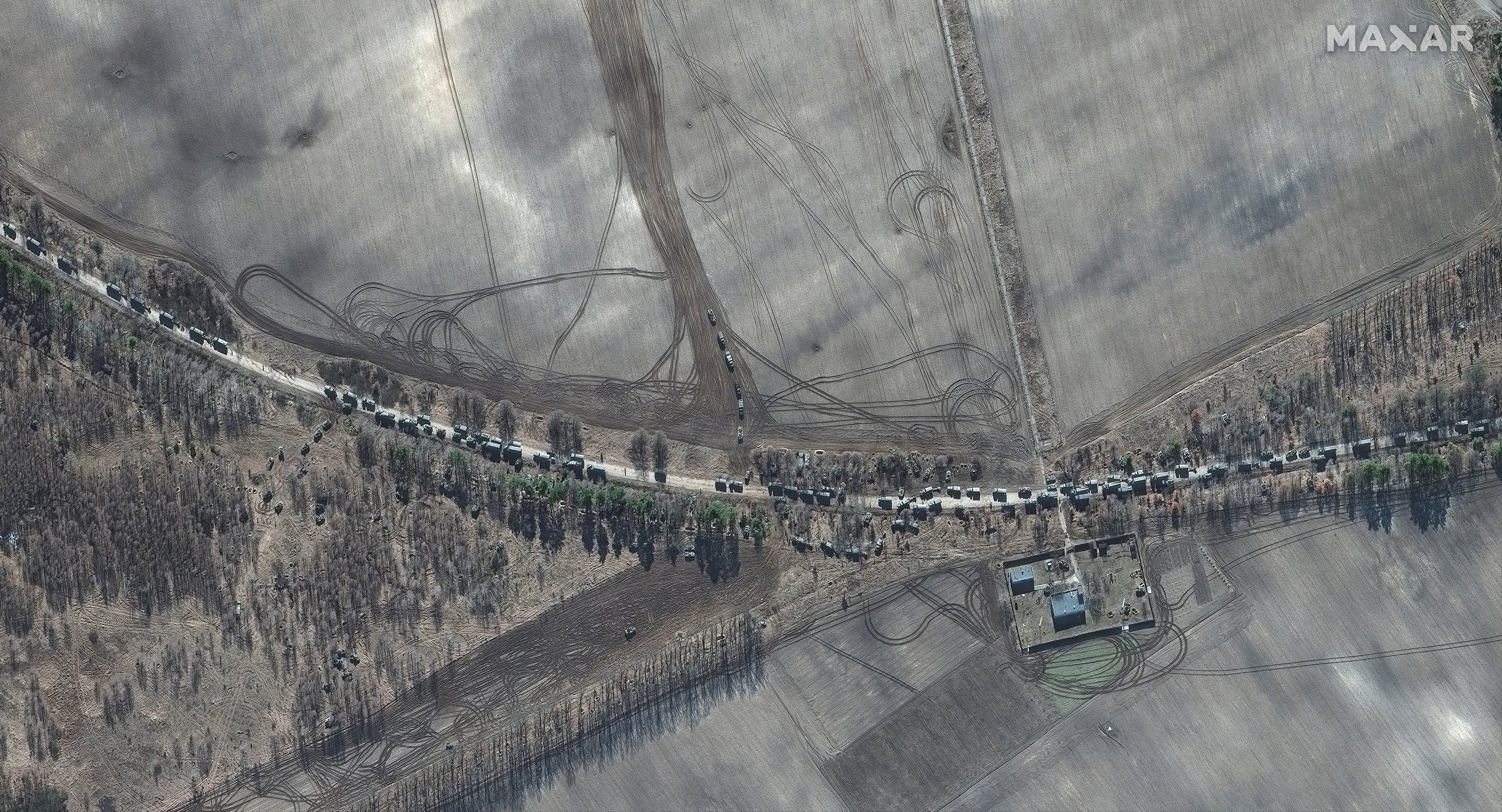 The southern end of a convoy of armour towed artillery trucks, east of Antonov airport, on Kyiv outskirts
