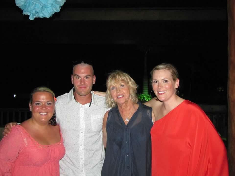 Michael Keaton’s nephew, Michael Douglas Scichilone, poses with the his mother - the actor’s sister, Pam - and two sisters, Meghan and Emily