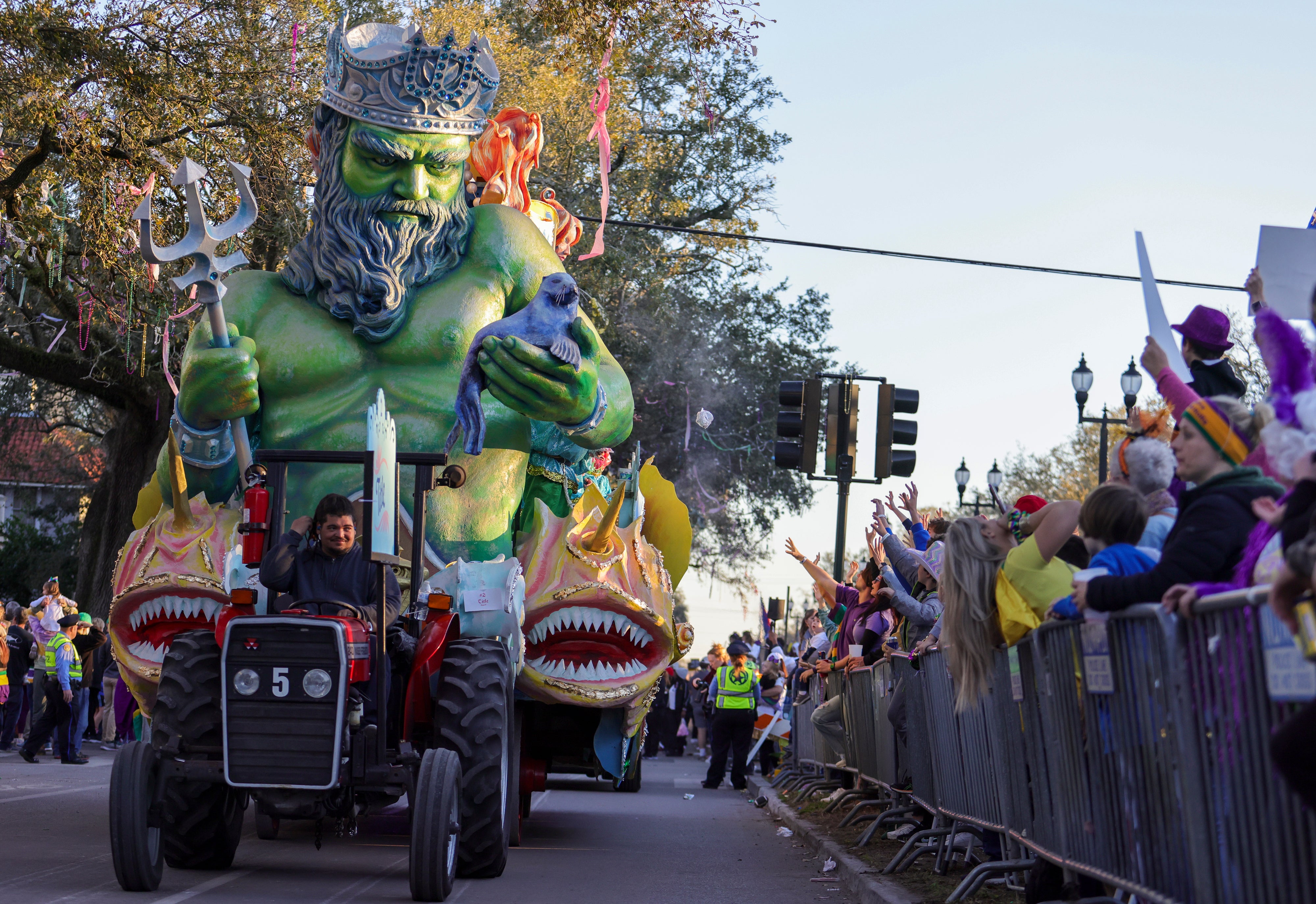 The Krewe of Proteus rolls on the Uptown route with the theme “Divine Tricksters” in New Orleans on Monday, Feb. 28, 2022
