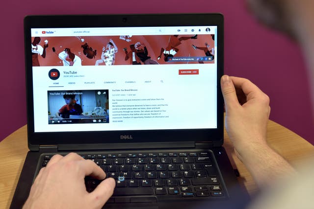 YouTube displayed on a laptop computer (PA)