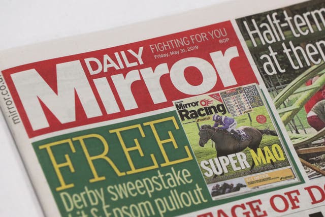 The publisher of the Mirror and Express newspapers has seen shares plunge as it warned that higher printing costs are set to impact profits this year (Jonathan Brady/PA)