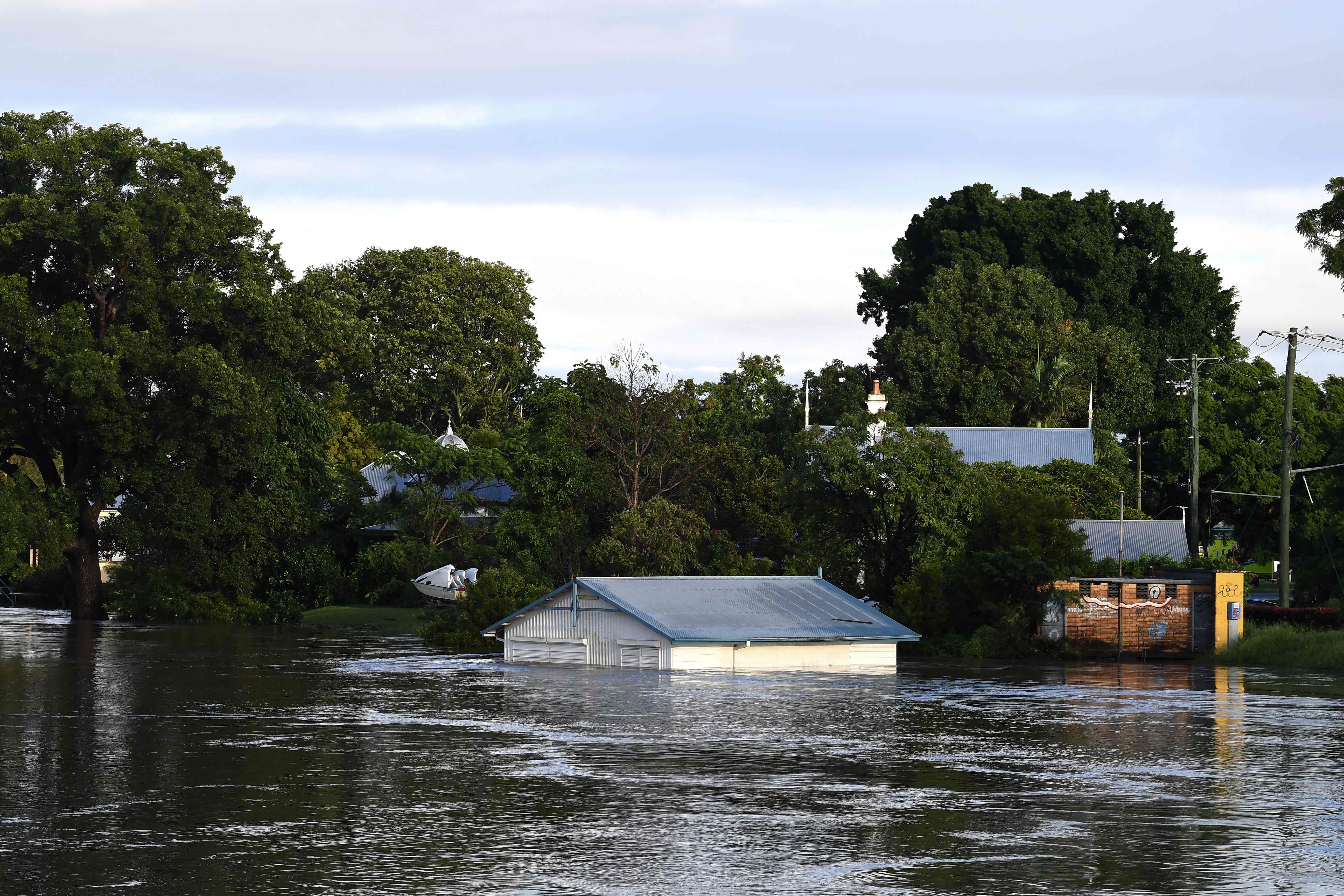 A submerged shed is seen on the bank of overflowing Clarence River in Grafton, some 130 kms from the New South Wales town Lismore on 1 March