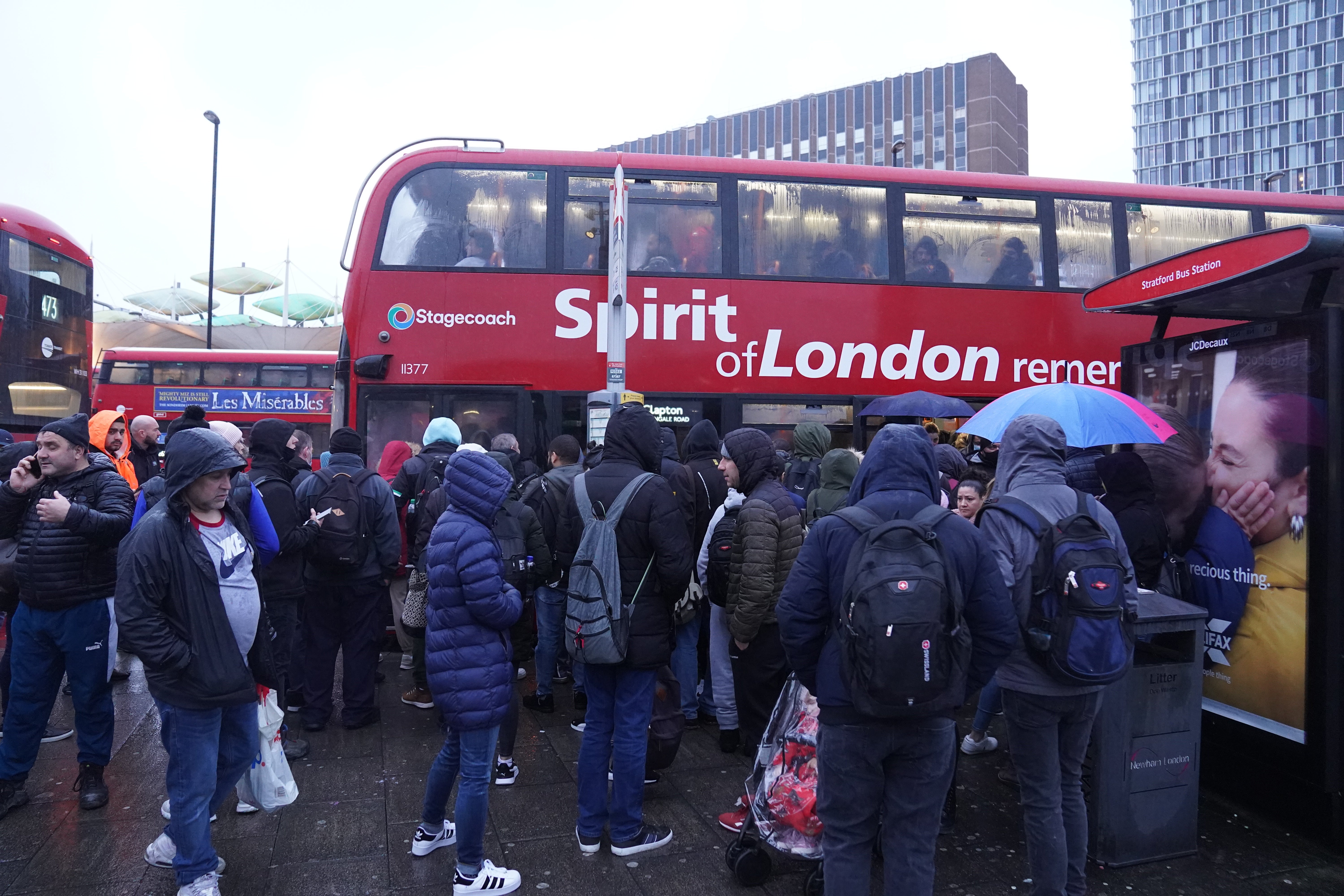 People wait for buses at Stratford station in east London as the Tube network is paralysed by a 24-strike by RMT members (Stefan Roussea/PA)